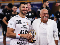 Yehia El-Deraa, Veszprem player, receives the Man of the Match award in the Zamalek vs Veszprem match in the Men's Handball Club World Champ...