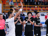 Yehia El-Deraa of Veszprem celebrates with fans after receiving the Man of the Match award in his team's match against Zamalek in the Men's...