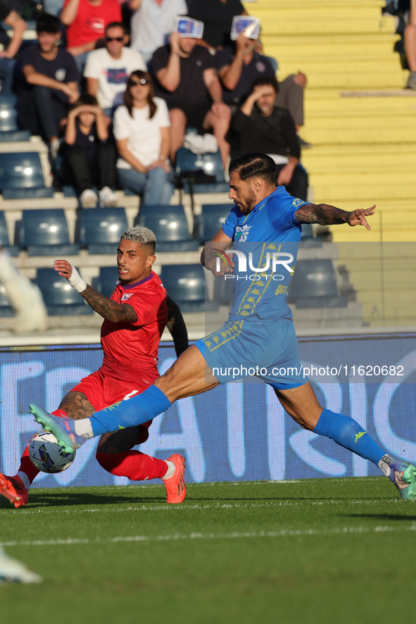 Giuseppe Pezzella of Empoli FC and Domilson Cordeiro Dos Santos Dodo of ACF Fiorentina battle for the ball during the Serie A match between...