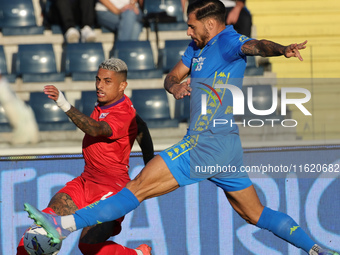 Giuseppe Pezzella of Empoli FC and Domilson Cordeiro Dos Santos Dodo of ACF Fiorentina battle for the ball during the Serie A match between...