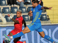 Giuseppe Pezzella of Empoli FC and Domilson Cordeiro Dos Santos Dodo of ACF Fiorentina battle for the ball during the Serie A match between...