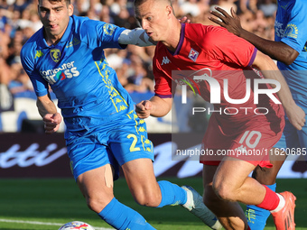 Saba Goglichidze of Empoli FC and Albert Gudmundsson of ACF Fiorentina battle for the ball during the Serie A match between Empoli FC and AC...