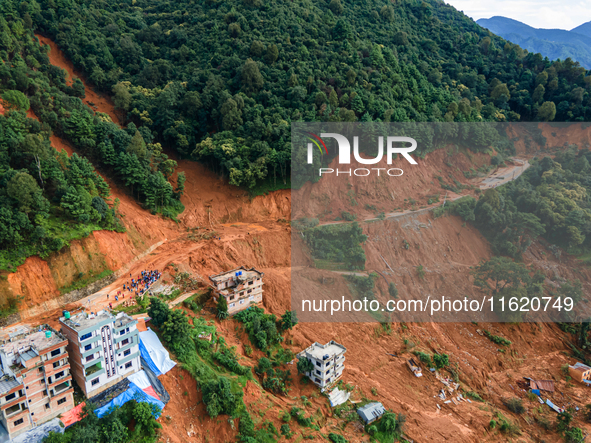 A drone view shows roadblocks on Charghare caused by landslides due to heavy rainfall in southern Lalitpur, Nepal, on September 29, 2024. 