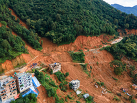 A drone view shows roadblocks on Charghare caused by landslides due to heavy rainfall in southern Lalitpur, Nepal, on September 29, 2024. (