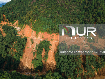 A drone view shows roadblocks on Charghare caused by landslides due to heavy rainfall in southern Lalitpur, Nepal, on September 29, 2024. (