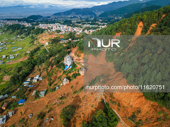 A drone view shows roadblocks on Charghare caused by landslides due to heavy rainfall in southern Lalitpur, Nepal, on September 29, 2024. 