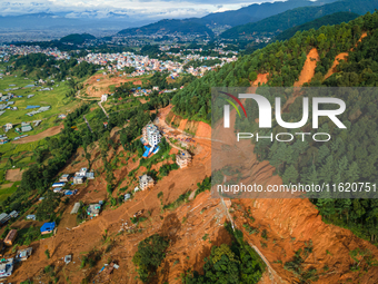 A drone view shows roadblocks on Charghare caused by landslides due to heavy rainfall in southern Lalitpur, Nepal, on September 29, 2024. (