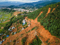 A drone view shows roadblocks on Charghare caused by landslides due to heavy rainfall in southern Lalitpur, Nepal, on September 29, 2024. (