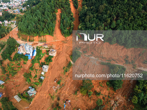 A drone view shows roadblocks on Charghare caused by landslides due to heavy rainfall in southern Lalitpur, Nepal, on September 29, 2024. 