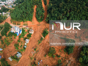 A drone view shows roadblocks on Charghare caused by landslides due to heavy rainfall in southern Lalitpur, Nepal, on September 29, 2024. (