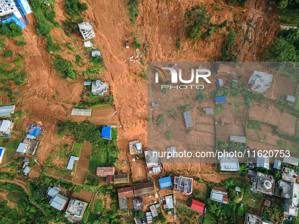 A drone view shows roadblocks on Charghare caused by landslides due to heavy rainfall in southern Lalitpur, Nepal, on September 29, 2024. 