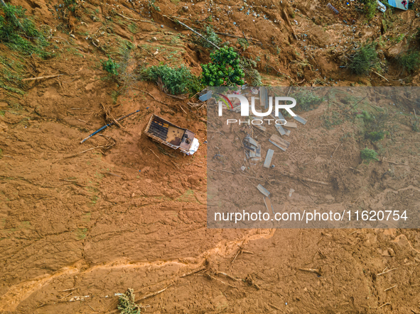 A drone view shows roadblocks on Charghare caused by landslides due to heavy rainfall in southern Lalitpur, Nepal, on September 29, 2024. 