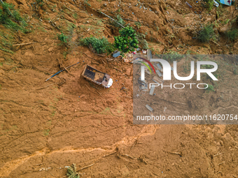 A drone view shows roadblocks on Charghare caused by landslides due to heavy rainfall in southern Lalitpur, Nepal, on September 29, 2024. (