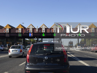 Cars drive near a toll at the 25 de Abril bridge in Lisbon, Portugal, on September 29, 2024. Data from the Portuguese Association of Highway...