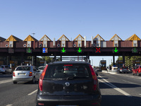 Cars drive near a toll at the 25 de Abril bridge in Lisbon, Portugal, on September 29, 2024. Data from the Portuguese Association of Highway...