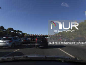 Cars drive near a toll at the 25 de Abril bridge in Lisbon, Portugal, on September 29, 2024. Data from the Portuguese Association of Highway...