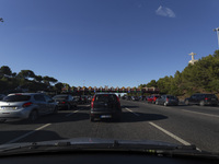 Cars drive near a toll at the 25 de Abril bridge in Lisbon, Portugal, on September 29, 2024. Data from the Portuguese Association of Highway...