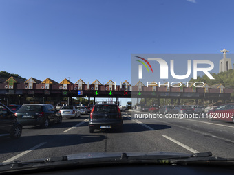 Cars drive near a toll at the 25 de Abril bridge in Lisbon, Portugal, on September 29, 2024. Data from the Portuguese Association of Highway...