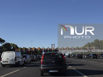 Cars drive near a toll at the 25 de Abril bridge in Lisbon, Portugal, on September 29, 2024. Data from the Portuguese Association of Highway...