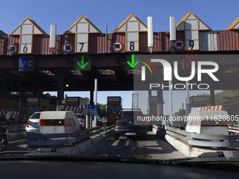 Cars drive near a toll at the 25 de Abril bridge in Lisbon, Portugal, on September 29, 2024. Data from the Portuguese Association of Highway...