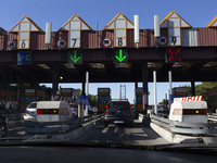 Cars drive near a toll at the 25 de Abril bridge in Lisbon, Portugal, on September 29, 2024. Data from the Portuguese Association of Highway...