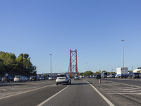 Cars drive near the 25 de Abril bridge in Lisbon, Portugal, on September 29, 2024. Data from the Portuguese Association of Highway Concessio...