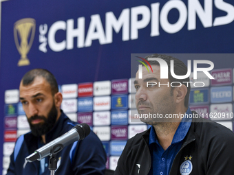 Roozbeh Cheshmi, Head Coach of Esteghlal FC, and player Javad Nekounam attend the press conference ahead of the AFC Champions League elite w...