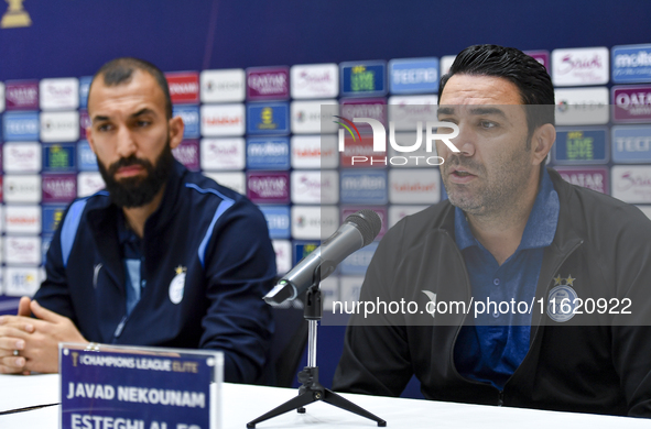 Roozbeh Cheshmi, Head Coach of Esteghlal FC, and player Javad Nekounam attend the press conference ahead of the AFC Champions League elite w...