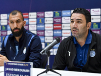 Roozbeh Cheshmi, Head Coach of Esteghlal FC, and player Javad Nekounam attend the press conference ahead of the AFC Champions League elite w...