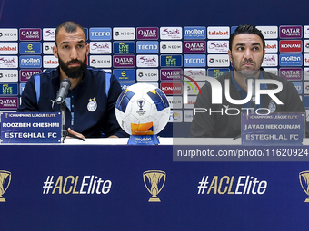 Roozbeh Cheshmi, Head Coach of Esteghlal FC, and player Javad Nekounam attend the press conference ahead of the AFC Champions League elite w...