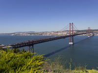 A general view of the 25 de Abril Bridge in Lisbon, Portugal, on September 29, 2024. Cristo Rei attracts pilgrims, tourists, and visitors fr...