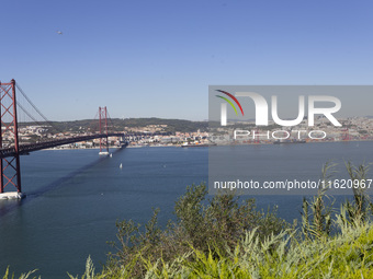 A general view of the 25 de Abril Bridge in Lisbon, Portugal, on September 29, 2024. Cristo Rei attracts pilgrims, tourists, and visitors fr...