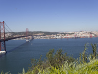 A general view of the 25 de Abril Bridge in Lisbon, Portugal, on September 29, 2024. Cristo Rei attracts pilgrims, tourists, and visitors fr...