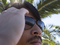 The 25 de Abril Bridge is reflected in a person's sunglasses in Lisbon, Portugal, on September 29, 2024. Cristo Rei attracts pilgrims, touri...