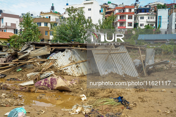 People's daily lives are affected after heavy rainfall and flooding of the Nakhu River in Lalitpur, Nepal, on September 29, 2024. 