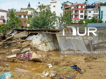 People's daily lives are affected after heavy rainfall and flooding of the Nakhu River in Lalitpur, Nepal, on September 29, 2024. (