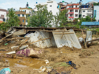 People's daily lives are affected after heavy rainfall and flooding of the Nakhu River in Lalitpur, Nepal, on September 29, 2024. (