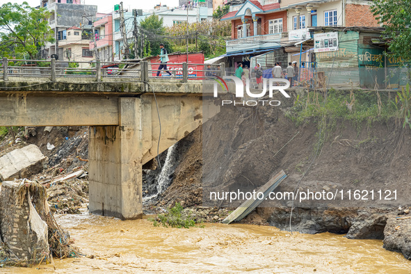 People's daily lives are affected after heavy rainfall and flooding of the Nakhu River in Lalitpur, Nepal, on September 29, 2024. 