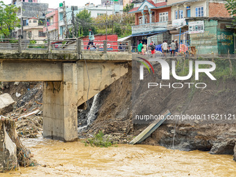 People's daily lives are affected after heavy rainfall and flooding of the Nakhu River in Lalitpur, Nepal, on September 29, 2024. (