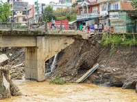 People's daily lives are affected after heavy rainfall and flooding of the Nakhu River in Lalitpur, Nepal, on September 29, 2024. (