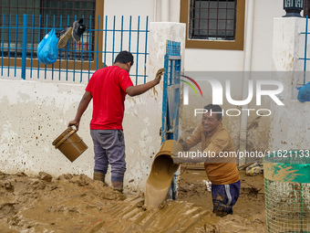 People's daily lives are affected after heavy rainfall and flooding of the Nakhu River in Lalitpur, Nepal, on September 29, 2024. People cle...