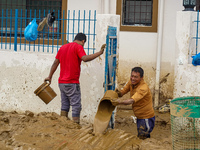 People's daily lives are affected after heavy rainfall and flooding of the Nakhu River in Lalitpur, Nepal, on September 29, 2024. People cle...