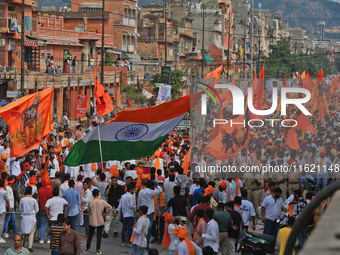 Yuva Shakti Manch activists participate in a 'Bhagva' rally demanding a Hindu Nation, Uniform Civil Code (UCC), and Population Control Act i...