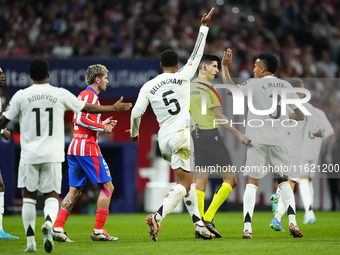 Real Madrid players protest to Referee Mateo Busquets Ferrer during the LaLiga match between Atletico de Madrid and Real Madrid CF  at Estad...