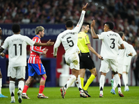 Real Madrid players protest to Referee Mateo Busquets Ferrer during the LaLiga match between Atletico de Madrid and Real Madrid CF  at Estad...