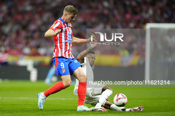 Alexander Sorloth centre-forward of Atletico de Madrid and Norway and Eder Militao centre-back of Real Madrid and Brazil compete for the bal...