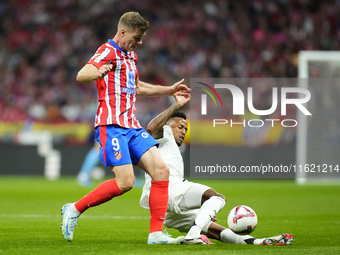 Alexander Sorloth centre-forward of Atletico de Madrid and Norway and Eder Militao centre-back of Real Madrid and Brazil compete for the bal...