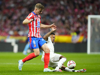 Alexander Sorloth centre-forward of Atletico de Madrid and Norway and Eder Militao centre-back of Real Madrid and Brazil compete for the bal...