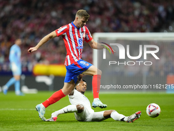 Alexander Sorloth centre-forward of Atletico de Madrid and Norway and Eder Militao centre-back of Real Madrid and Brazil compete for the bal...