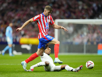 Alexander Sorloth centre-forward of Atletico de Madrid and Norway and Eder Militao centre-back of Real Madrid and Brazil compete for the bal...